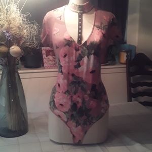 Pink floral bodysuit with snap connection